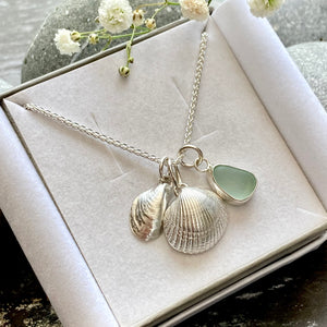 a. PENDANT . sea shell and sea glass cluster