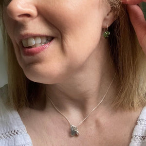 a. EARRINGS . dangles . green blue